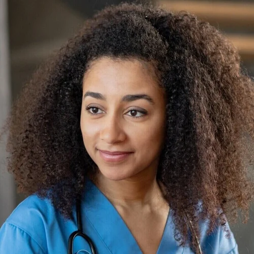 Persona photo for Erica, a cardiac nurse, in blue scrubs with a stethoscope