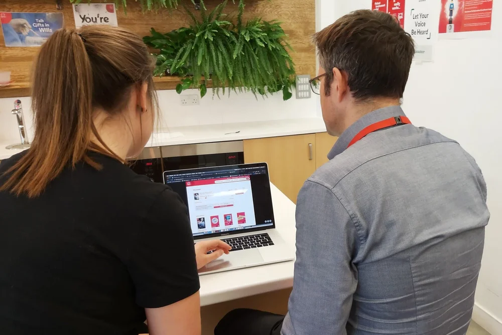 Usability testing session: a participant working through the prototype on a laptop