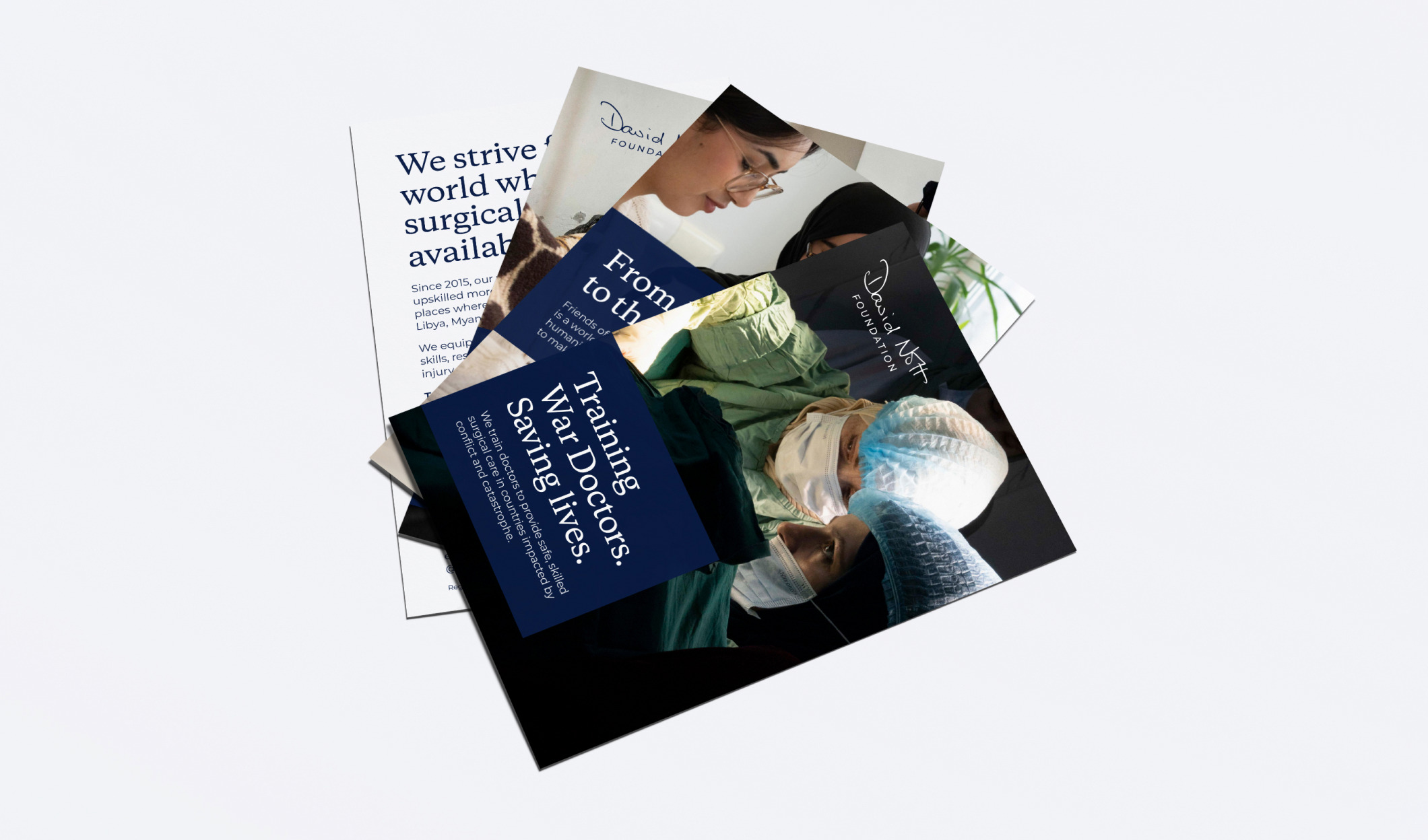 A fan of David Nott Foundation flyers, including &lsquo;Training war doctors. Saving lives.&rsquo; over a photo of surgeons operating
