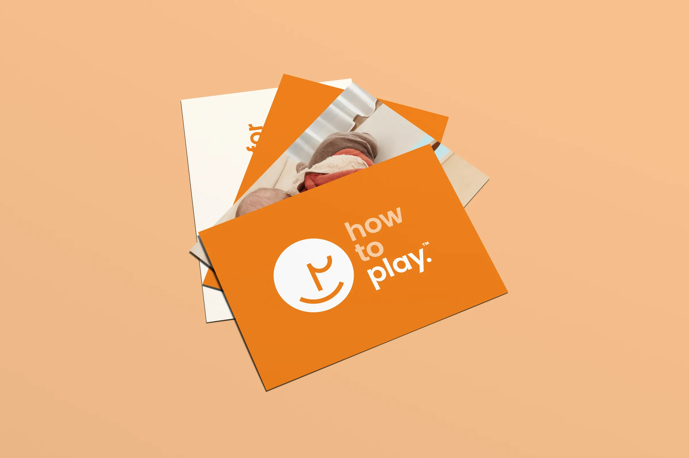 Spread of Howto postcards in orange and warm white, one showing the Howtoplay logo